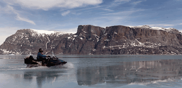 snow mobile travel over sea ice in uummannaq greenland 3155 3500x2332px